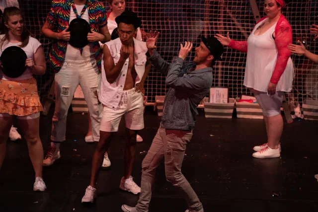 Chris performing as Judas in Godspell, All for the Best